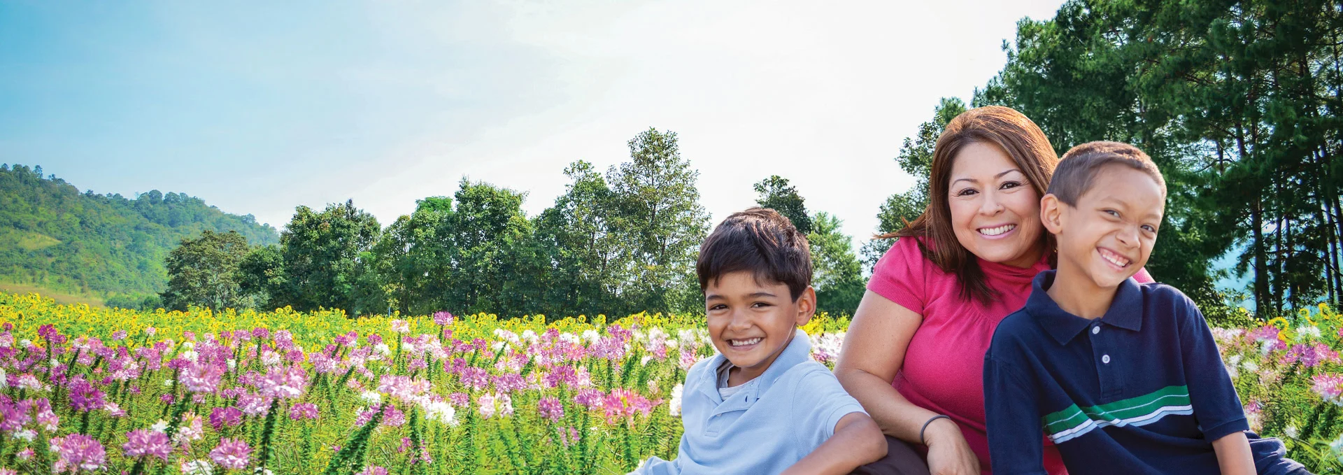 Bancroft Dental Care family after teeth cleaning in a field of flowers San Leandro CA